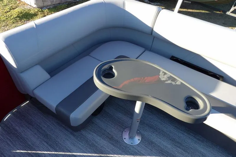 Slide: The Image of 2026 Bennington 21 S L-Bench with sleek seating and modern table design. - 20