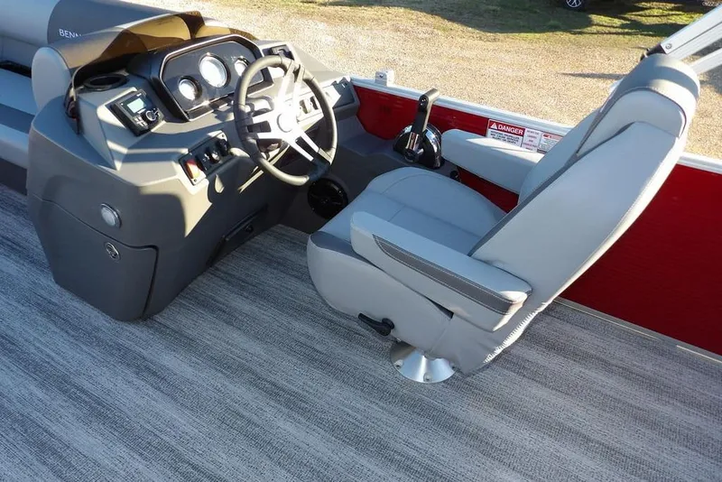 Slide: The Image of 2026 Bennington 21 S L-Bench boat interior with steering console and captain's chair. - 22