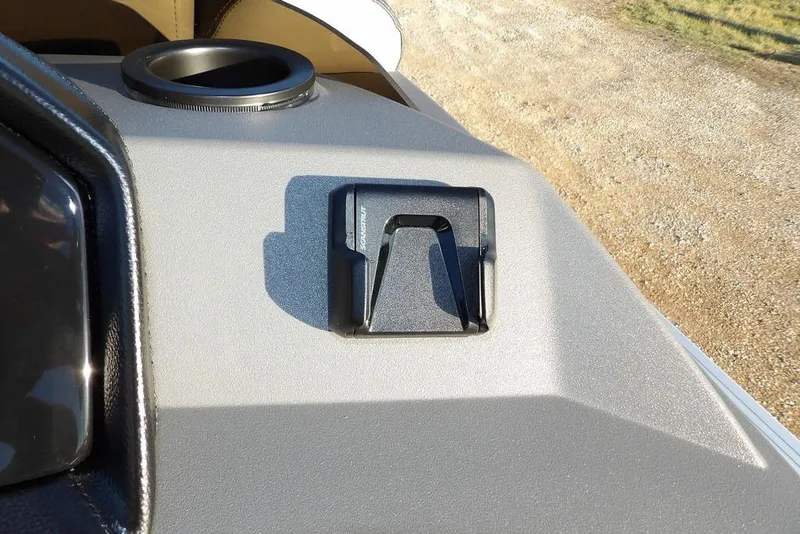 Slide: The Image of 2026 Bennington 21 S L-Bench boat dashboard with cup holder and mount. - 24