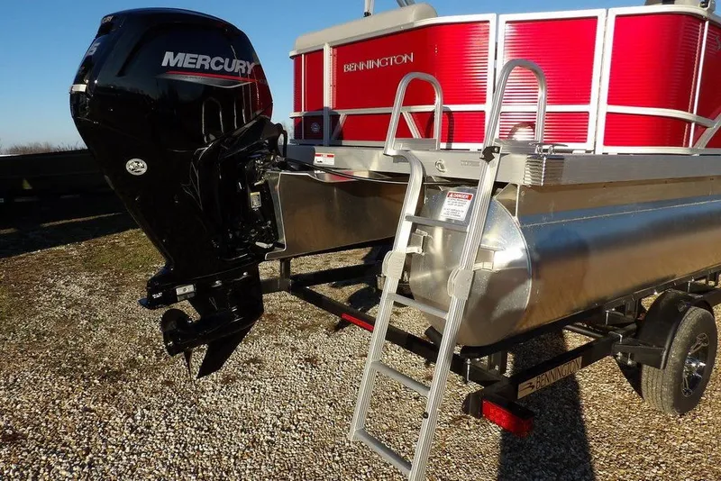 Slide: The Image of 2026 Bennington 21 S L-Bench pontoon boat with Mercury outboard motor and ladder. - 25