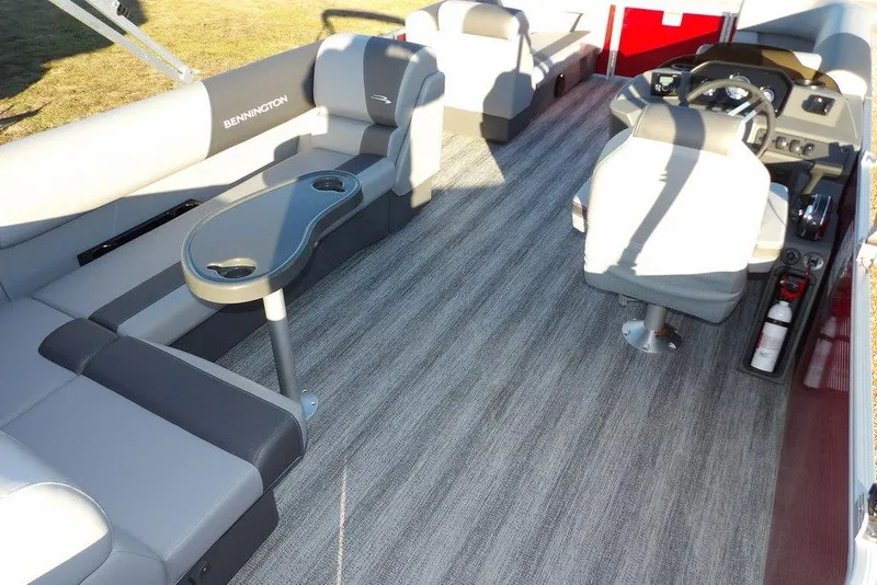 Slide: The Image of 2026 Bennington 21 S L-Bench pontoon boat interior with seating and steering console. - 30