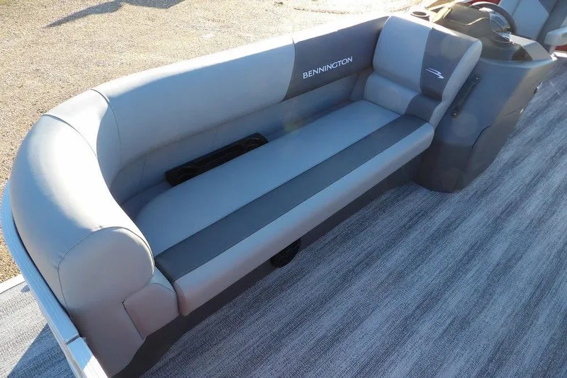 Slide: The Image of 2026 Bennington 21 S L-Bench boat seat, gray upholstery, outdoor setting. - 6