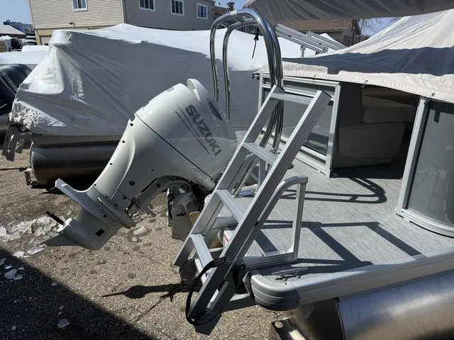 Slide: The Image of Sweetwater SW2086CPSE 2026 pontoon boat with Suzuki outboard motor. - 9
