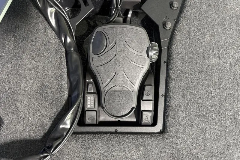 Slide: The Image of Foot pedal control system in 2026 Skeeter ZXE20 boat, featuring textured grip and control buttons. - 1