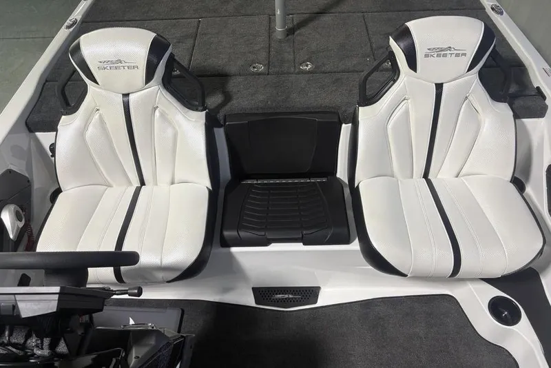 Slide: The Image of 2026 Skeeter ZXE20 boat interior with white and black seats. - 14