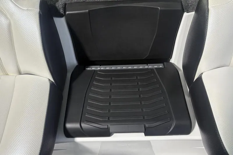 Slide: The Image of 2026 Skeeter ZXE20 boat interior with black and white seating and storage compartment. - 17