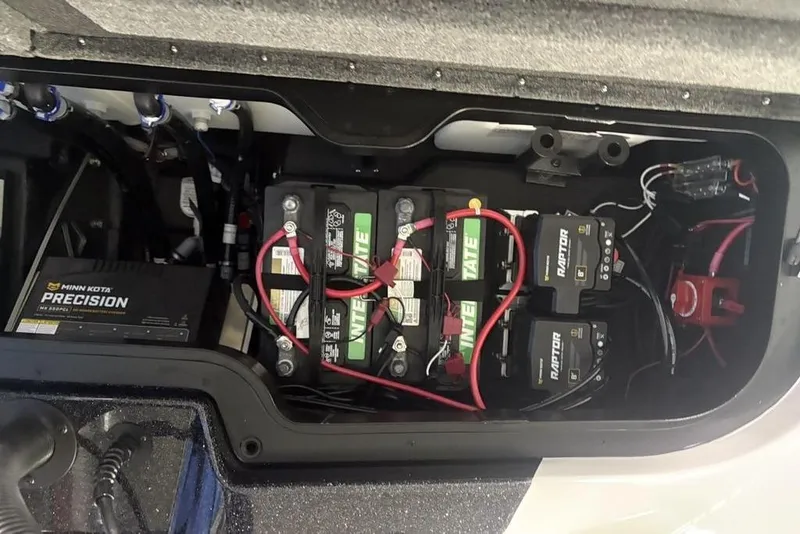 Slide: The Image of Battery compartment of 2026 Skeeter ZXE20 boat with Minn Kota Precision charger. - 22
