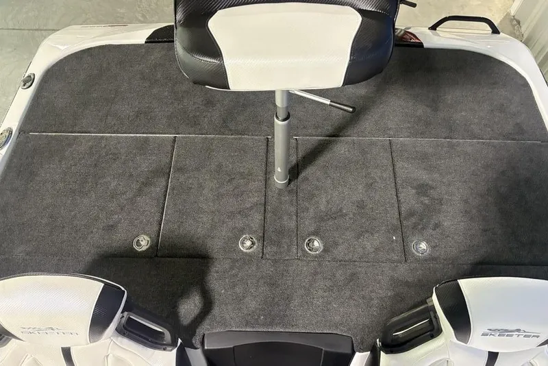 Slide: The Image of 2026 Skeeter ZXE20 boat deck with seating and storage compartments. - 23