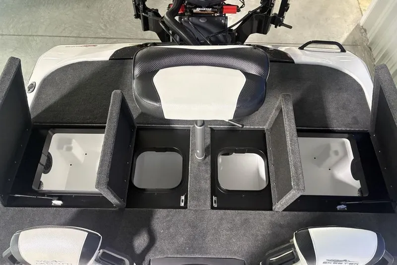 Slide: The Image of 2026 Skeeter ZXE20 boat interior with open storage compartments and seating. - 25