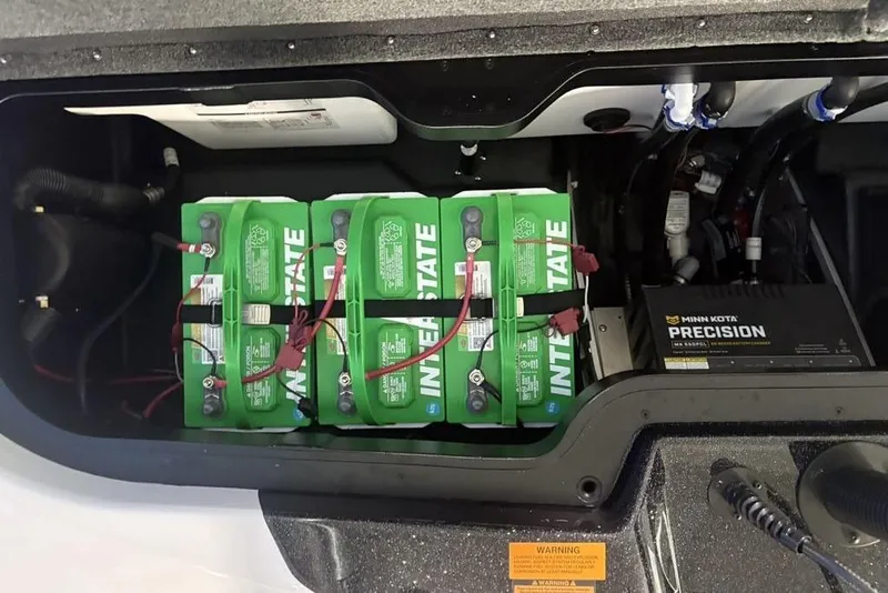 Slide: The Image of Batteries and charger in 2026 Skeeter ZXE20 boat compartment. - 30