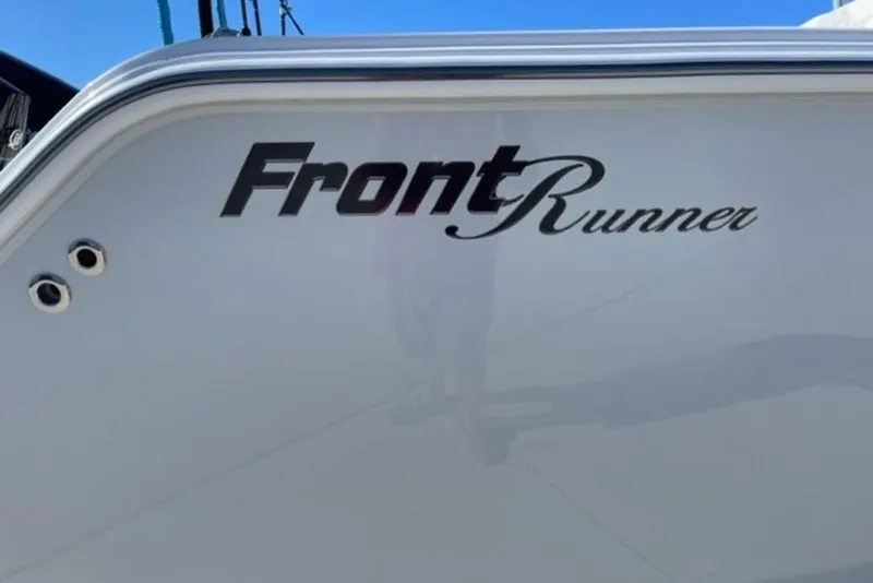 Slide: The Image of 2023 Front Runner 33 Center Console boat with logo on the side. - 10