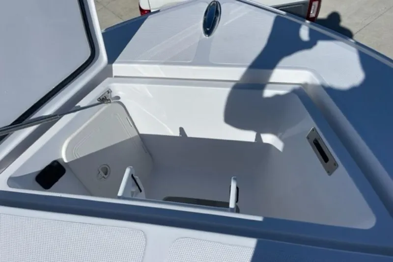 Slide: The Image of Open storage compartment on 2023 Front Runner 33 Center Console boat. - 15