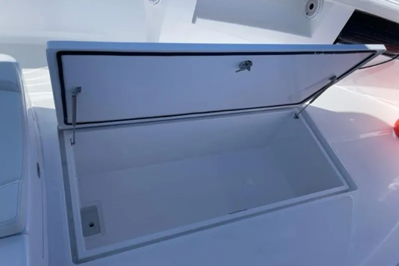 Slide: The Image of Open storage compartment on 2023 Front Runner 33 Center Console boat. - 17