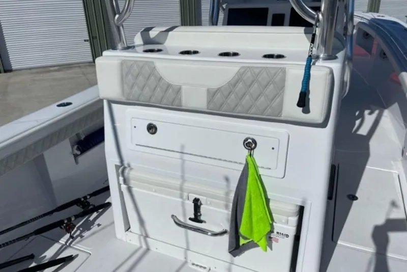 Slide: The Image of 2023 Front Runner 33 Center Console boat interior with storage and fishing rod holders. - 19