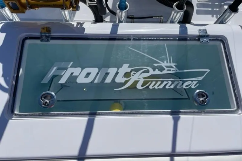 Slide: The Image of 2023 Front Runner 33 Center Console boat logo on glass panel. - 22