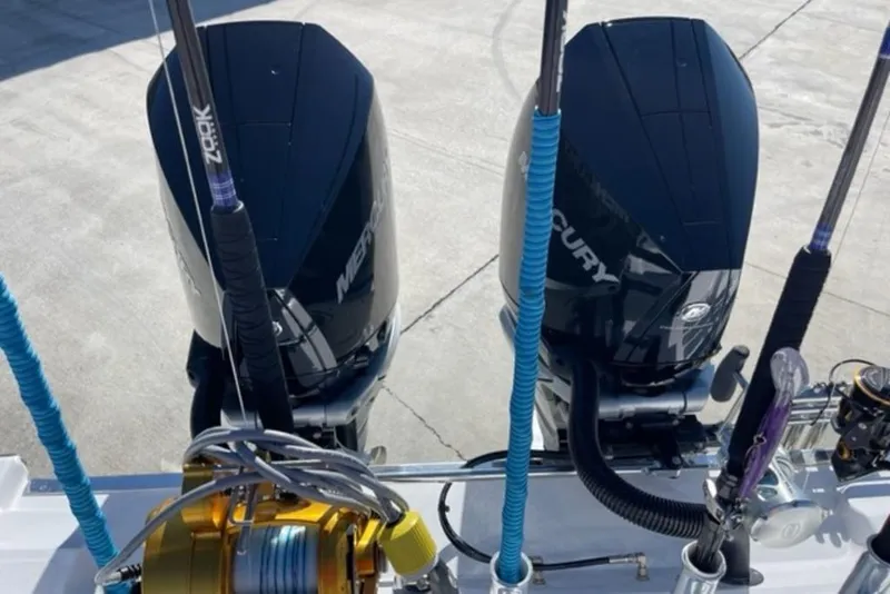 Slide: The Image of Twin Mercury outboard engines on a 2023 Front Runner 33 Center Console boat. - 25