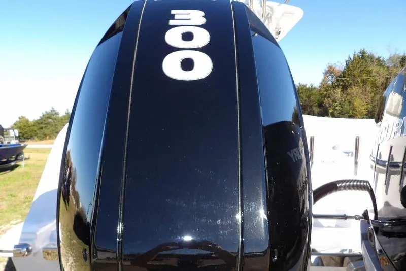 Slide: The Image of Close-up of a 300 horsepower engine on a 2023 Front Runner 33 Center Console boat. - 27