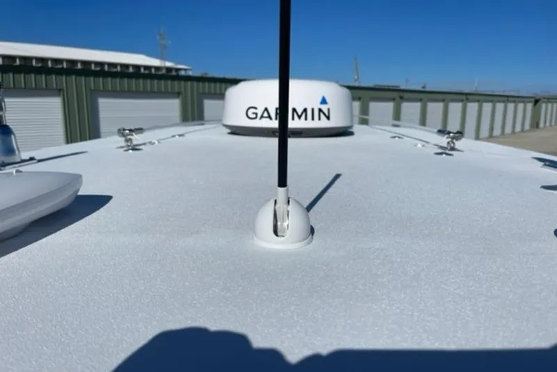 Slide: The Image of 2023 Front Runner 33 Center Console boat with Garmin equipment on deck. - 9