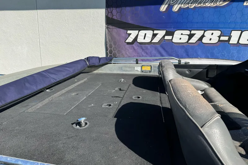 Slide: The Image of Interior view of a 1997 Ranger 488VS boat, showcasing seating and deck details. - 11