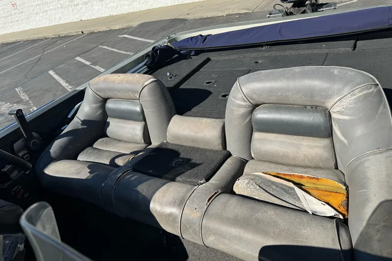 Slide: The Image of Worn interior seats of a 1997 Ranger 488VS boat, showing visible damage and aging. - 16
