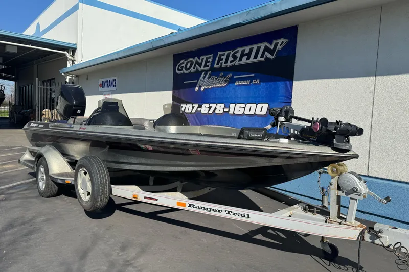 Slide: The Image of 1997 Ranger 488VS fishing boat on trailer outside "Gone Fishin'" store. - 7
