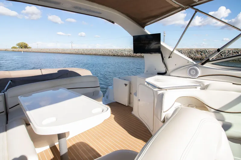 Slide: The Image of Interior of a 2002 Wellcraft 3300 Martinique yacht with seating area. - 1