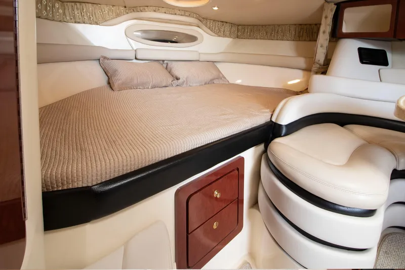 Slide: The Image of Interior of 2002 Wellcraft 3300 Martinique with cozy bed and seating area. - 13