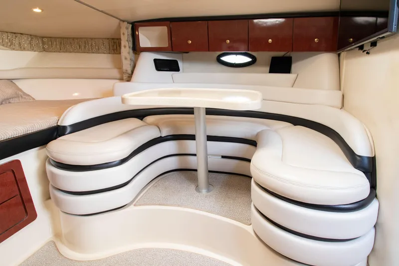 Slide: The Image of Interior of 2002 Wellcraft 3300 Martinique with elegant seating area. - 14