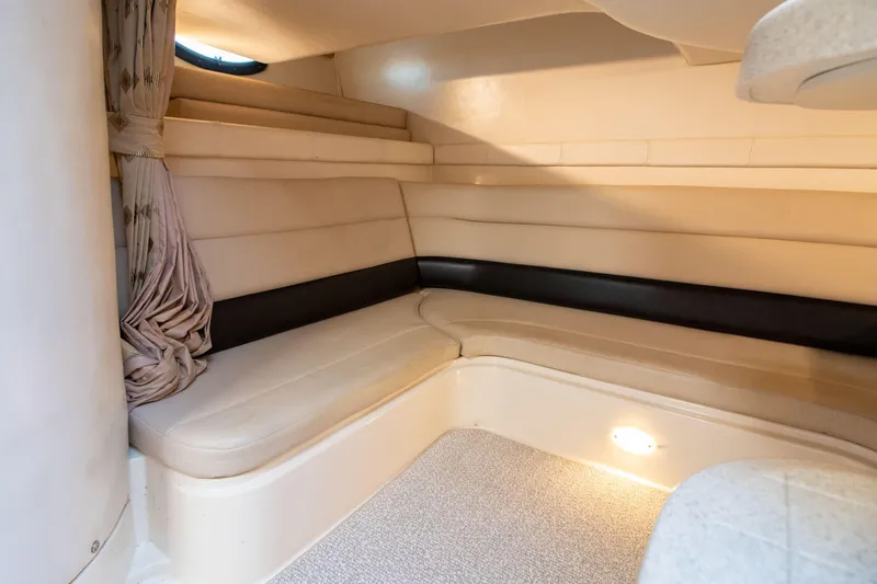 Slide: The Image of Interior of 2002 Wellcraft 3300 Martinique with beige upholstery. - 17