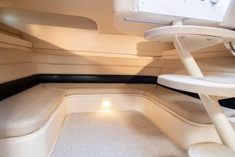 Slide: The Image of Interior of 2002 Wellcraft 3300 Martinique with seating area and stairs. - 18