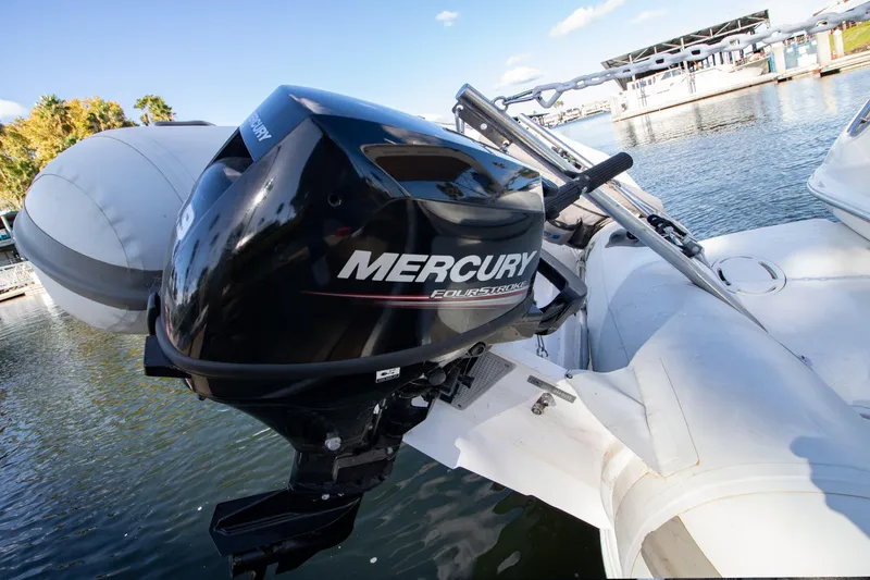 Slide: The Image of Mercury outboard motor on a 2002 Wellcraft 3300 Martinique boat. - 21