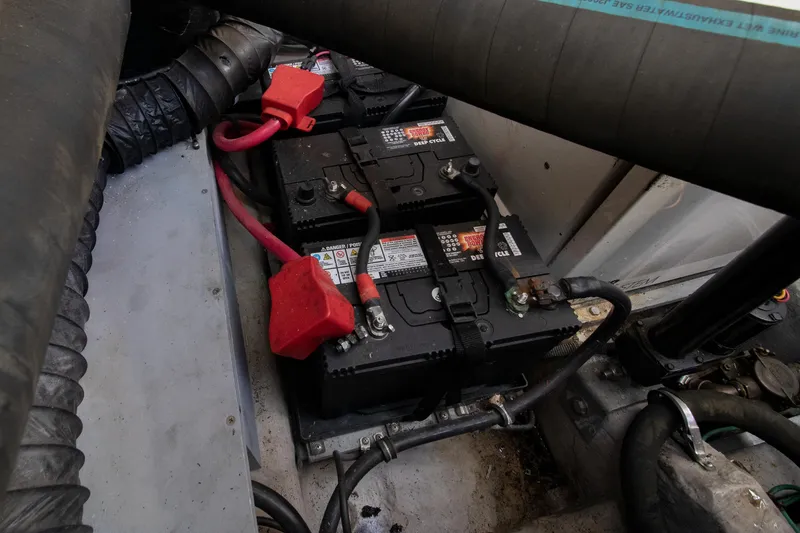 Slide: The Image of Batteries in the engine compartment of a 2002 Wellcraft 3300 Martinique boat. - 23