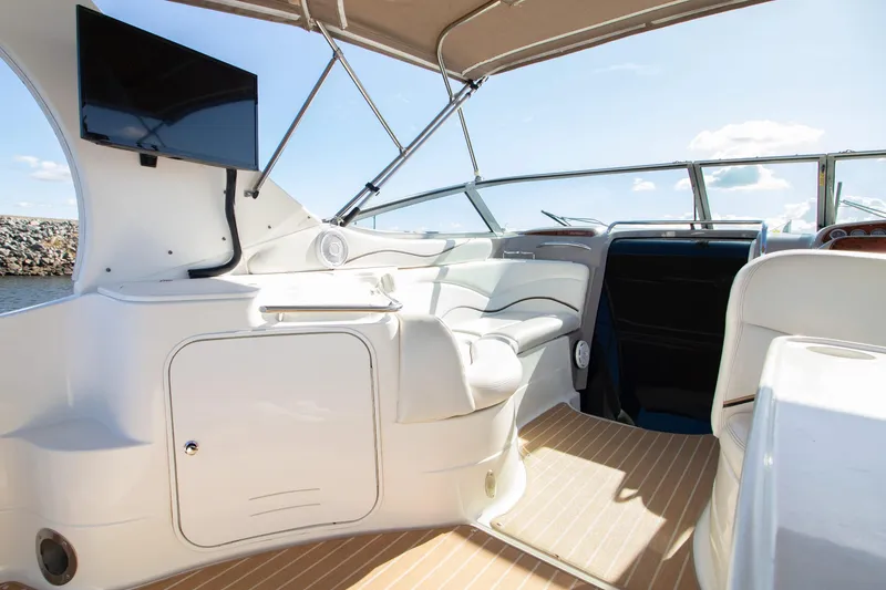 Slide: The Image of Interior of 2002 Wellcraft 3300 Martinique with TV and seating area. - 6