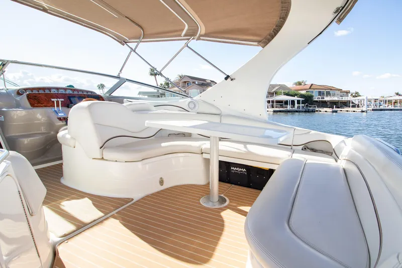 Slide: The Image of Interior of a 2002 Wellcraft 3300 Martinique yacht with seating area. - 7