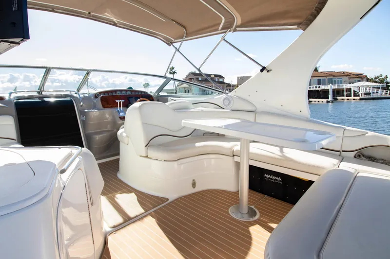 Slide: The Image of Interior of a 2002 Wellcraft 3300 Martinique yacht with seating area. - 8