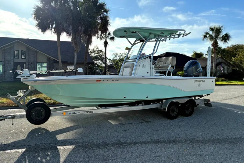 The Image of 2016 Sea Fox 220 Viper boat on trailer, parked near palm trees and houses. - 0