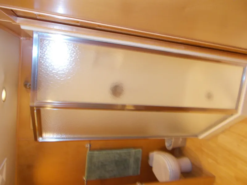 Slide: The Image of Bathroom in 2005 Sumerset Lake Bumz houseboat with shower and toilet. - 19