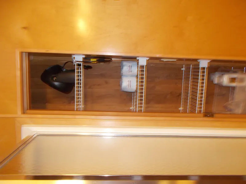 Slide: The Image of 2005 Sumerset Lake Bumz storage shelf with hairdryer and toiletries. - 20