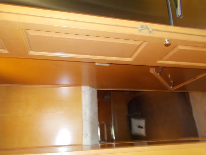 Slide: The Image of Interior view of 2005 Sumerset Lake Bumz houseboat with wooden cabinetry. - 26