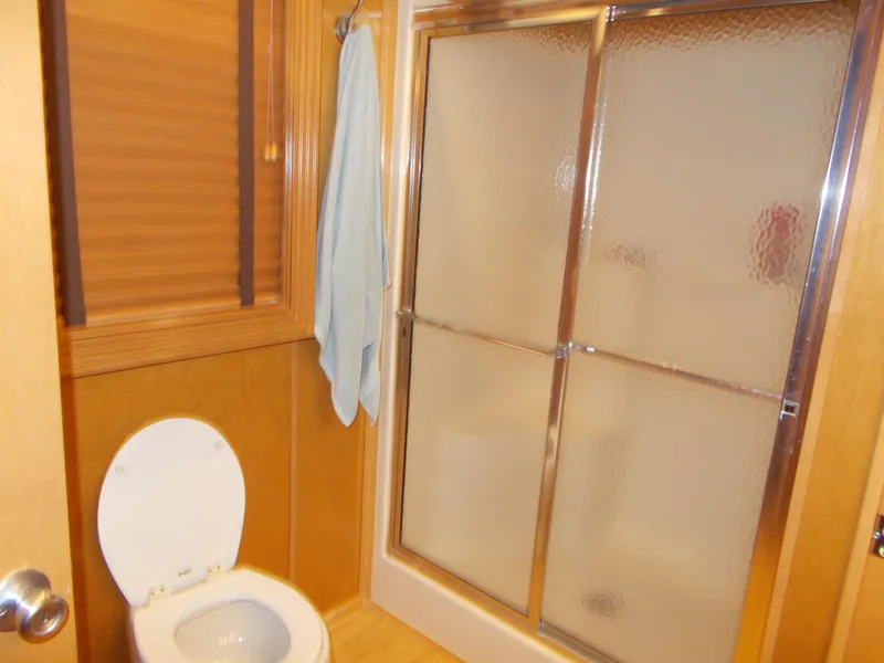 Slide: The Image of 2005 Sumerset Lake Bumz houseboat bathroom with shower and toilet. - 32