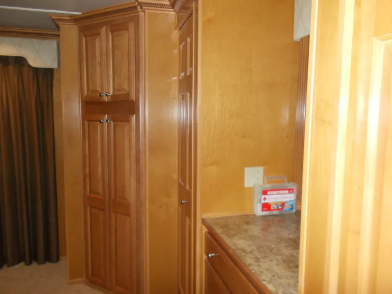 Slide: The Image of 2005 Sumerset Lake Bumz interior with wooden cabinets and countertop. - 33