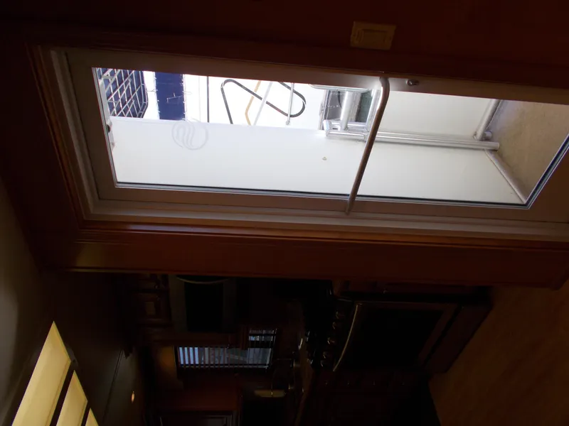 Slide: The Image of Interior view of 2005 Sumerset Lake Bumz houseboat kitchen with glass door. - 34