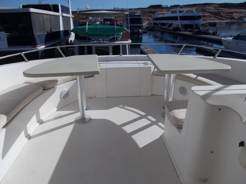 Slide: The Image of 2005 Sumerset Lake Bumz houseboat deck with seating and tables. - 42
