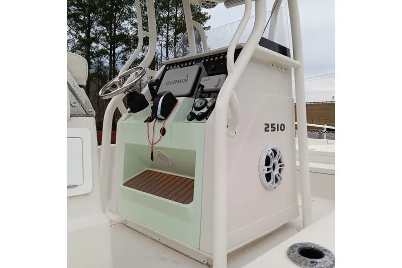 Slide: The Image of 2022 Ranger 2510 Bay boat console with Garmin navigation system and steering wheel. - 13