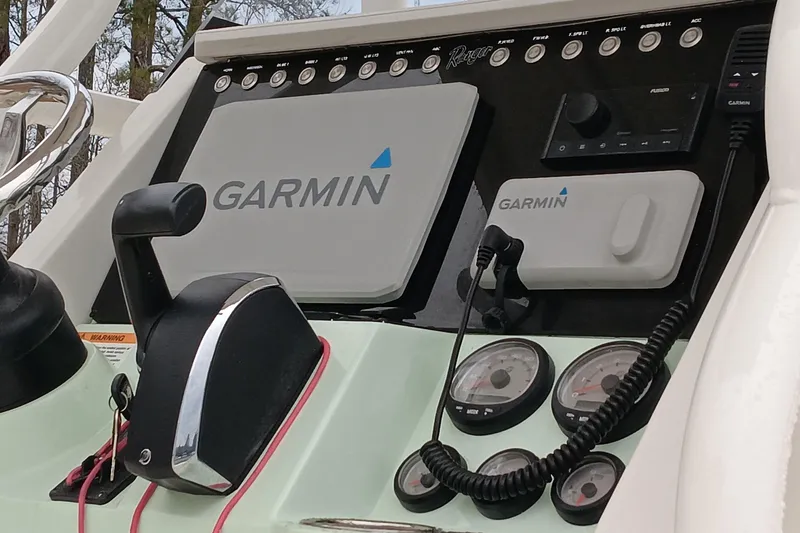 Slide: The Image of 2022 Ranger 2510 Bay boat dashboard with Garmin navigation system and controls. - 14