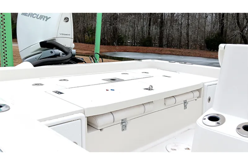 Slide: The Image of 2022 Ranger 2510 Bay boat interior with Mercury Verado engine, featuring storage compartments. - 20