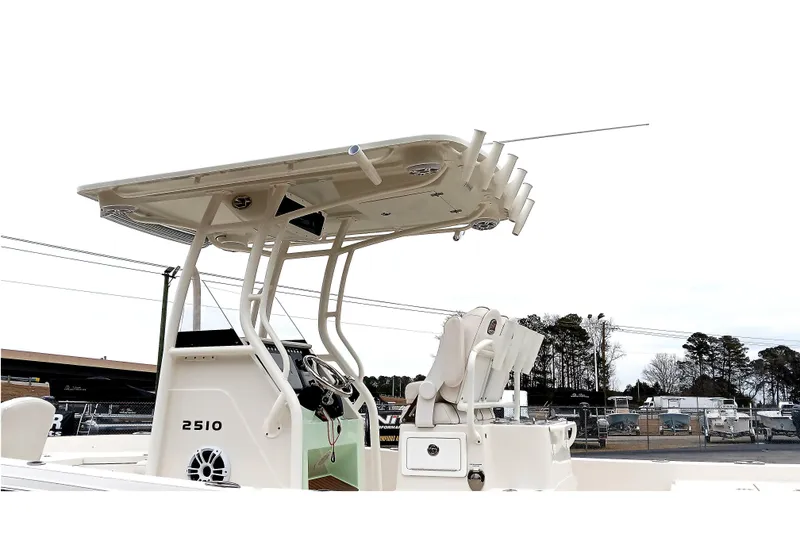 Slide: The Image of 2022 Ranger 2510 Bay boat with T-top and rod holders, side view. - 22