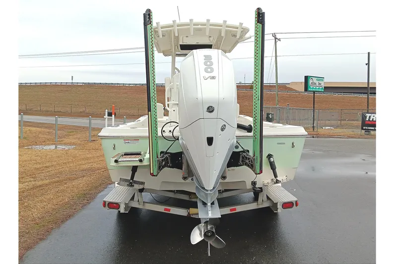 Slide: The Image of 2022 Ranger 2510 Bay boat with powerful V8 engine on trailer, rear view. - 3