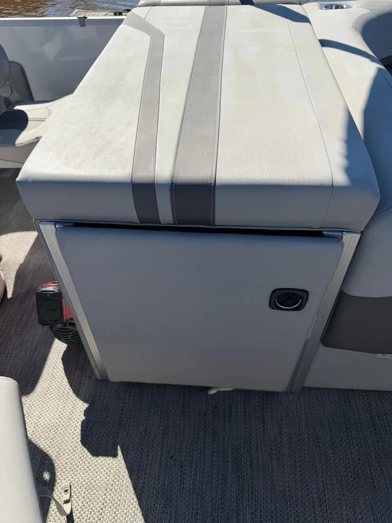 Slide: The Image of 2023 Bennington SX 22 boat interior with gray seating area. - 13