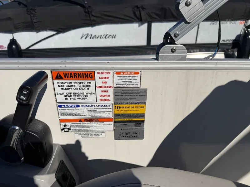 Slide: The Image of Warning labels on a 2023 Bennington SX 22 boat. - 15